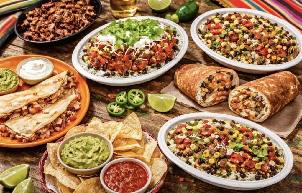 Cinco de Mayo food spread at chain restaurants featuring burritos, rice bowls, chips and guacamole