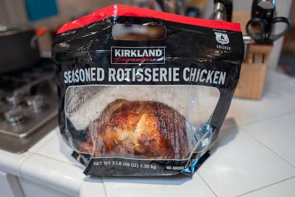 Kirkland Signature seasoned rotisserie chicken in packaging from Costco