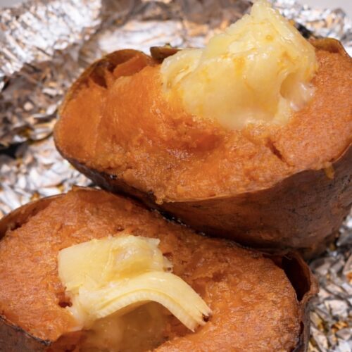 Roasted sweet potato with melty cheese recipe – best cheese for sweet potato melting over two slow-roasted sweet potatoes, showing the viral TikTok roasted sweet potato melty cheese recipe