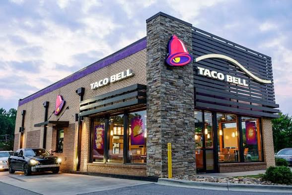 Taco Bell restaurant exterior featuring the secret menu sign