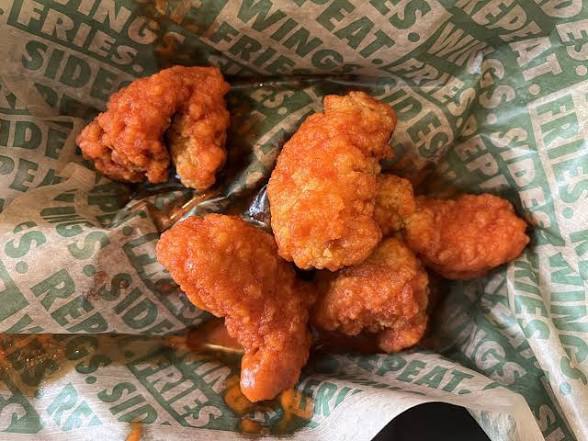 Mild wingstop flavor wings on a plate – ranked last among best wingstop flavors
