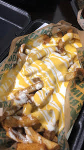 Wingstop Louisiana Voodoo Fries with cheese sauce and ranch