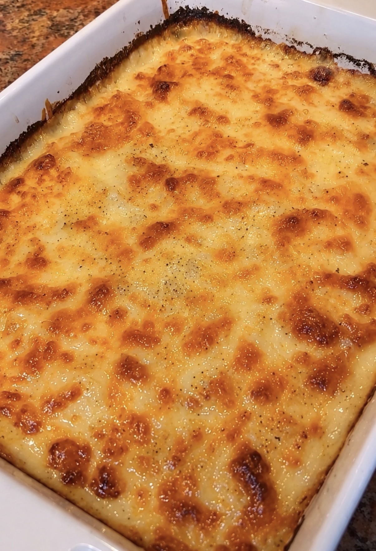 Au Gratin Potatoes Recipe (Real French Technique, Cheese Included) 4 Au gratin potatoes with golden bubbling cheese in a baking dish
