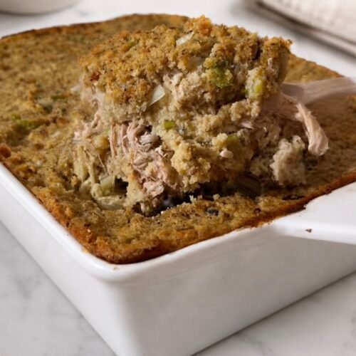 Cornbread Dressing Recipe (The Real Southern Method, Baked Separately) 1 Baked cornbread dressing in a casserole dish, golden brown on top