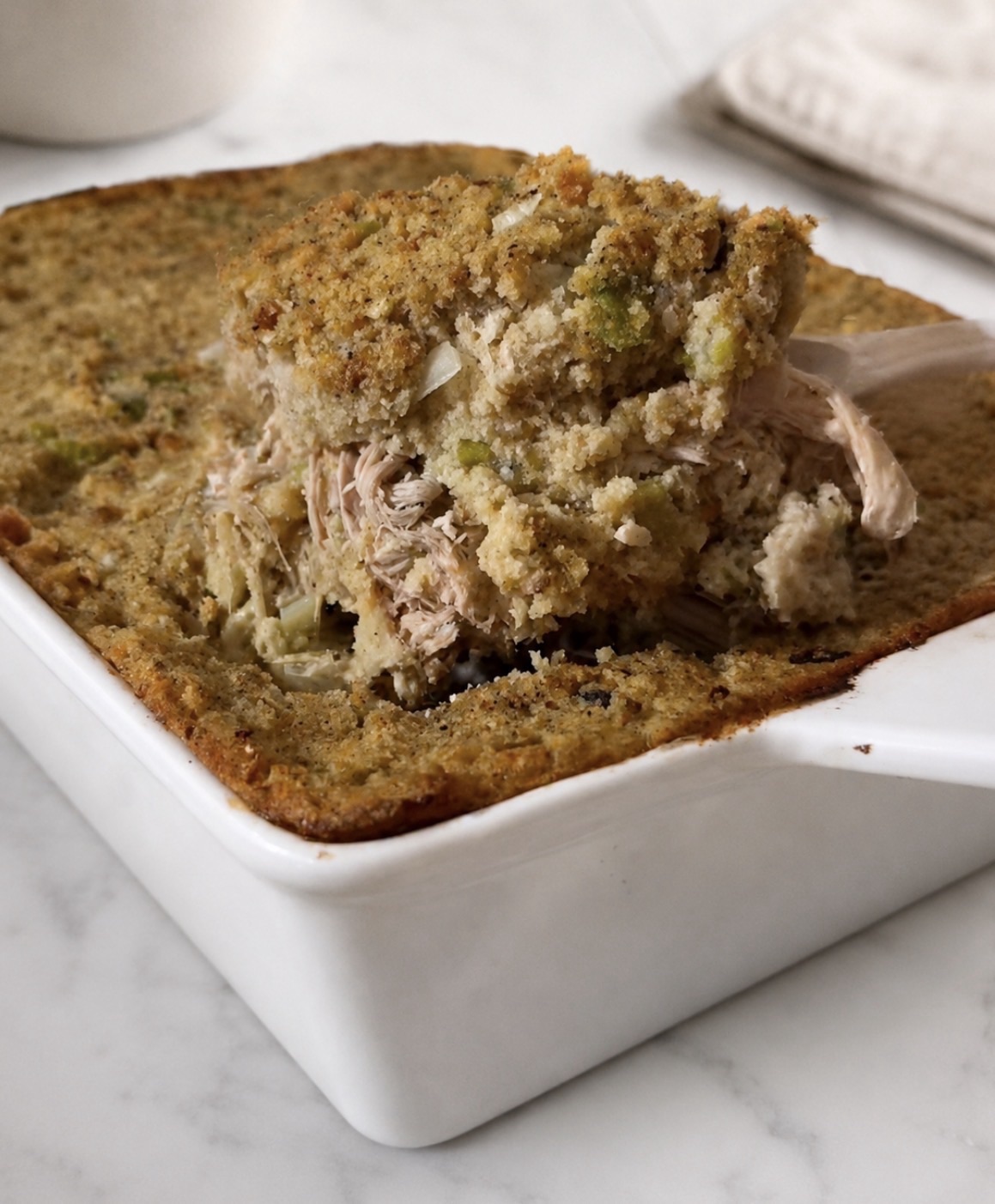 Cornbread Dressing Recipe (The Real Southern Method, Baked Separately) 1 Baked cornbread dressing in a casserole dish, golden brown on top