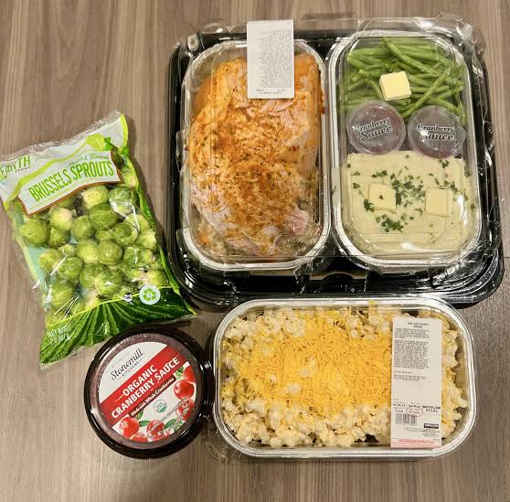 Costco's Thanksgiving Haul: What's Actually Worth Buying This Year 5 Costco Thanksgiving grocery haul with turkey dinner kit and sides