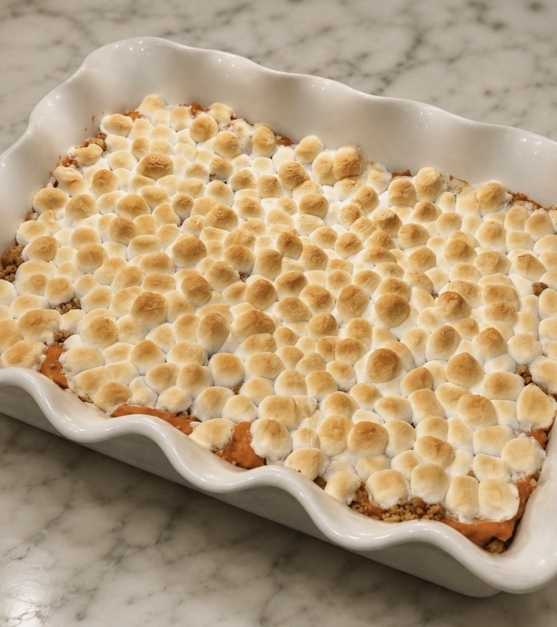 Sweet Potato Casserole Recipe (Marshmallow or Pecan Streusel) 3 Sweet potato casserole topped with toasted marshmallows in a baking dish