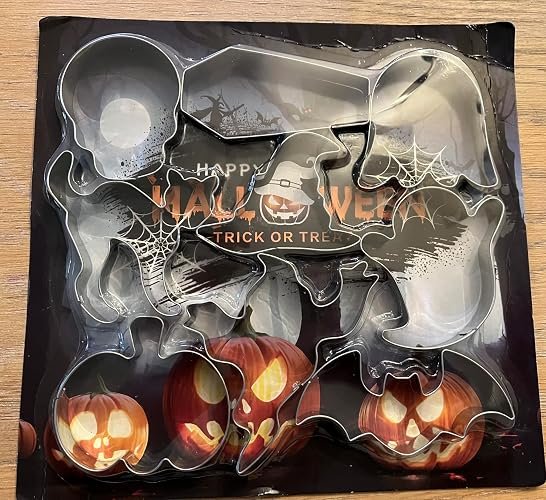 Metal Halloween cookie cutter set with bat, ghost, and pumpkin shapes