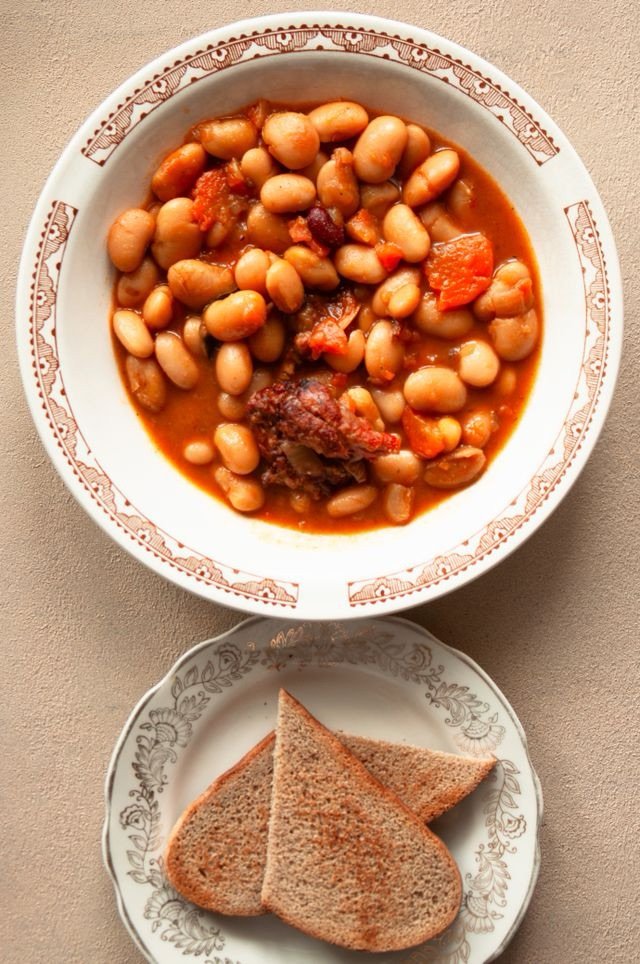 Bowl of mixed beans and vegetables, part of a daily bean-eating habit