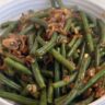 Green beans with crispy fried shallots on a plate