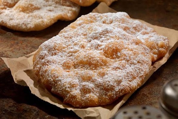 Fried elephant ear dough topped with cinnamon sugar