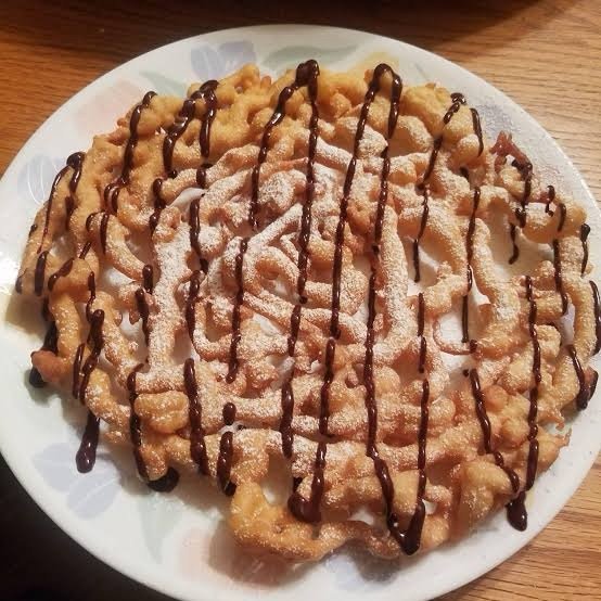 Homemade funnel cake dusted with powdered sugar
