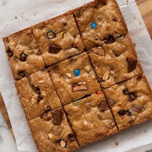 Leftover Halloween Candy Cookie Bars (Dump Whatever's Left in the Bowl) 1 Baked brown sugar cookie bars studded with chopped leftover Halloween candy