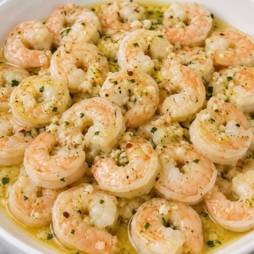Lemon Garlic Marinated Shrimp (Make It the Night Before) 1 Chilled lemon garlic marinated shrimp served on a plate as an appetizer