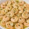 Chilled lemon garlic marinated shrimp served on a plate as an appetizer