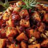 Maple roasted sweet potatoes with caramelized edges on a sheet pan