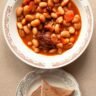 Bowl of mixed beans and vegetables, part of a daily bean-eating habit