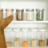 Shelf-stable summer pantry staples including canned tuna, canned beans, and dry pasta