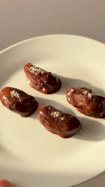 Dark chocolate tahini date bites rolled into balls
