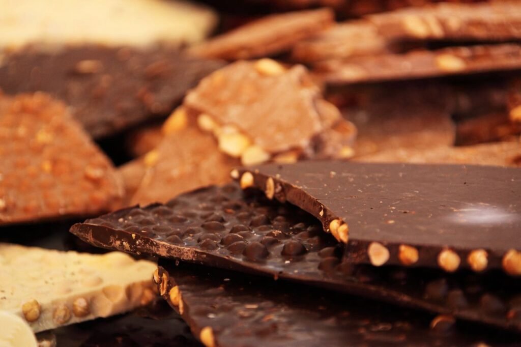 Dark chocolate almond bark topped with chopped almonds and flaky sea salt